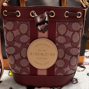 Coach Mini Dempsey Bucket Bag in Signature Jacquard.
